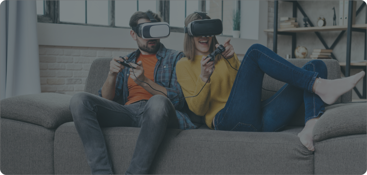 Two people on the sofa playing VR