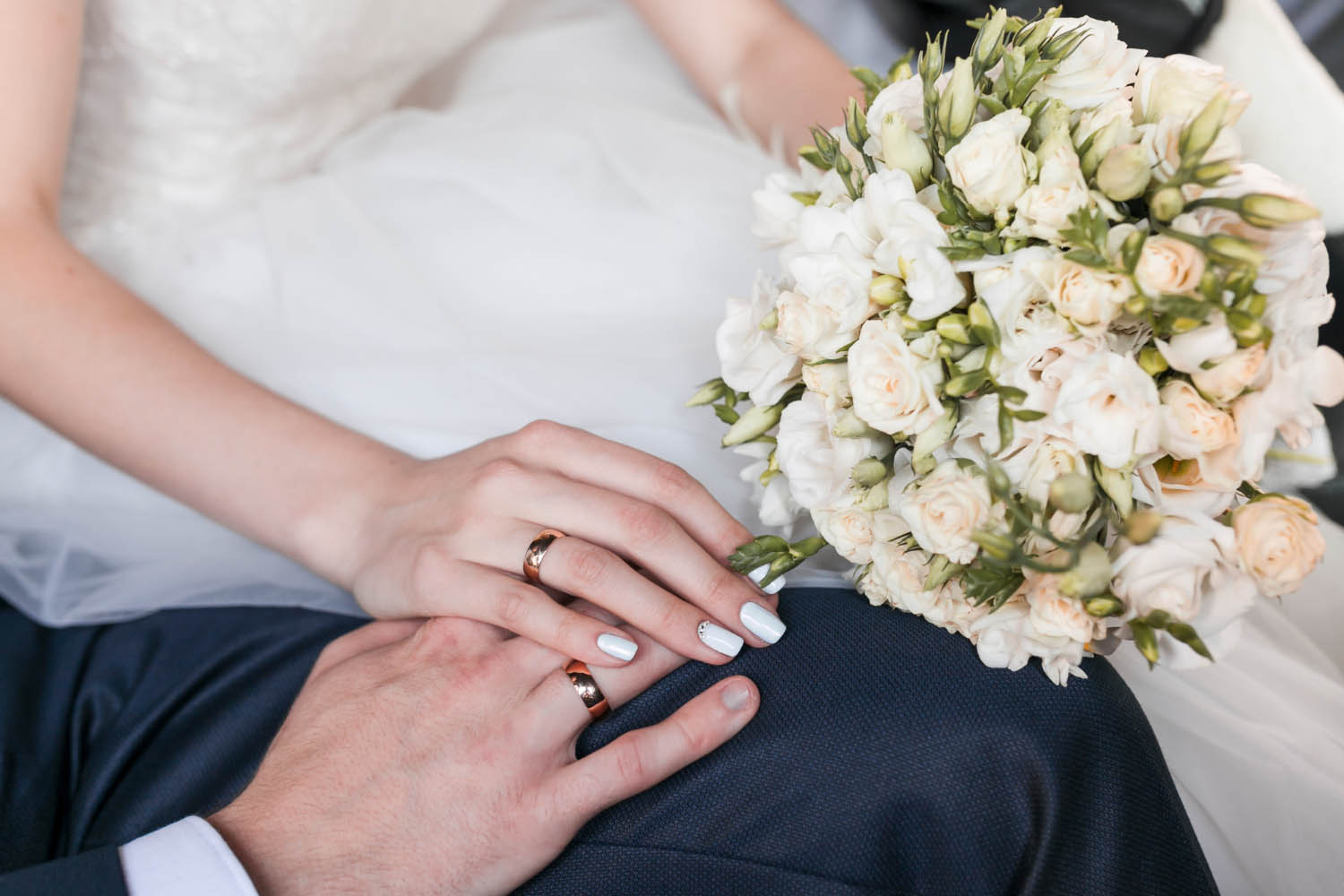 Couple holding hands and flowers