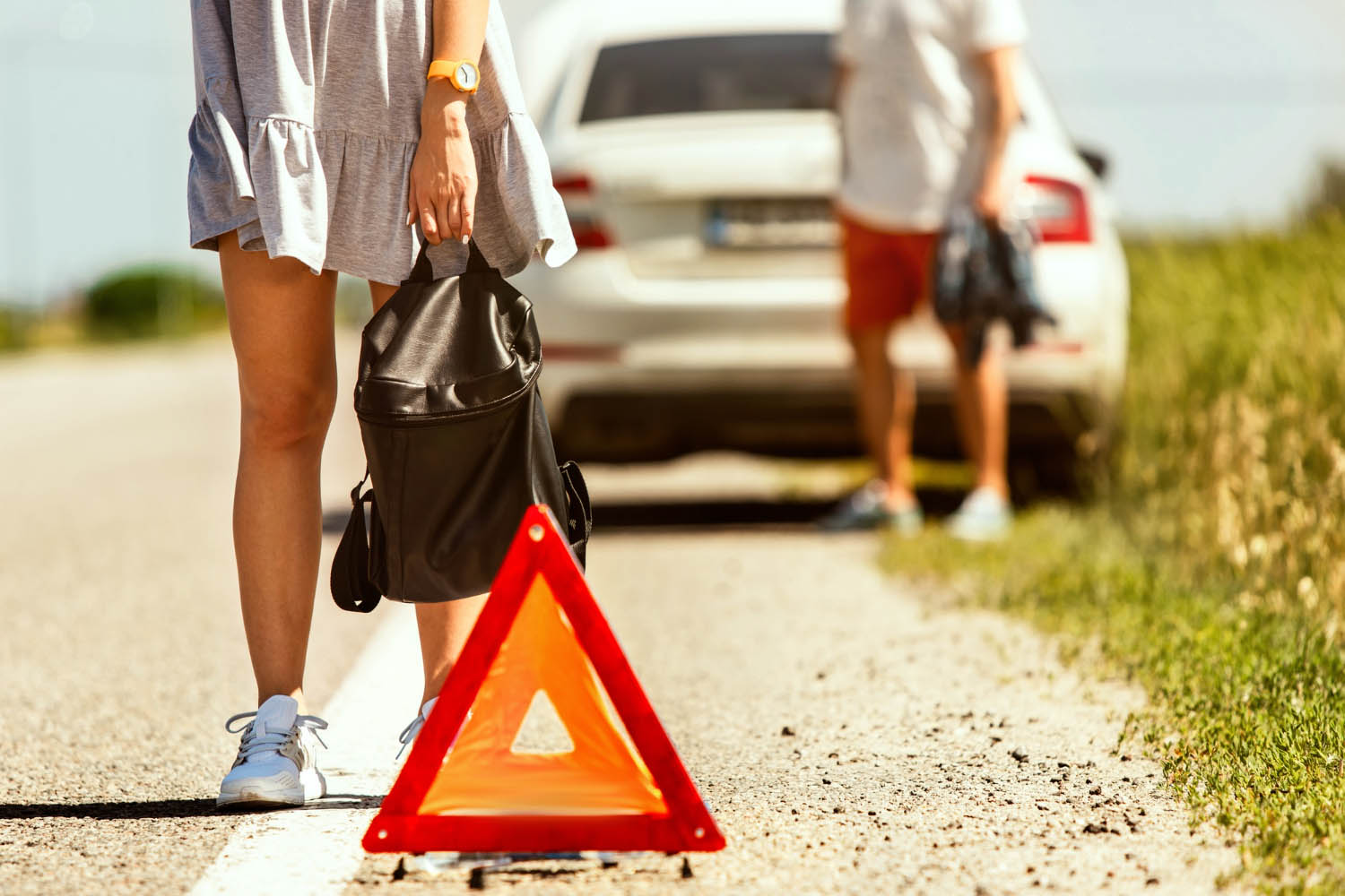 Young couple broke down car while traveling