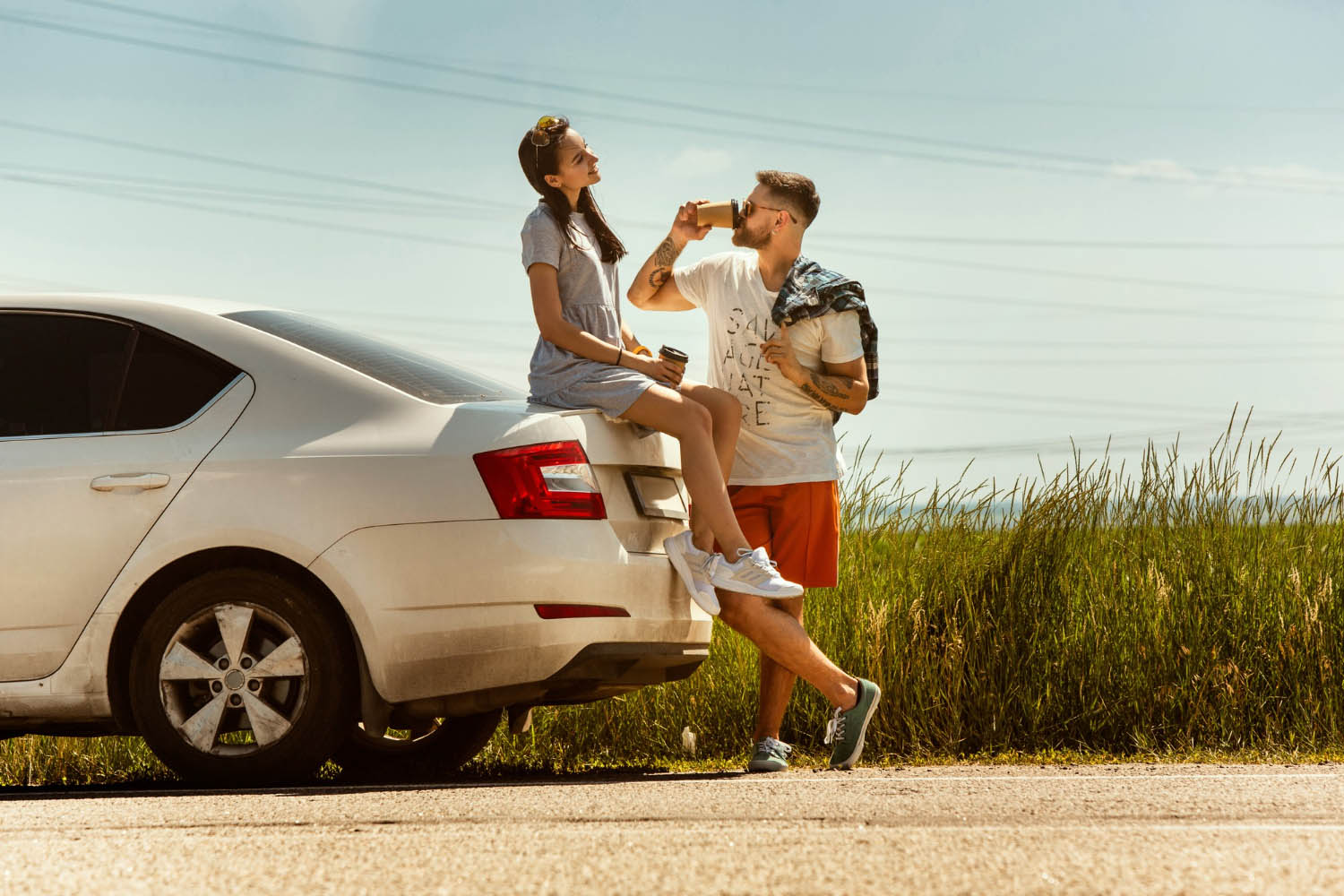 Young couple traveling car sunny day